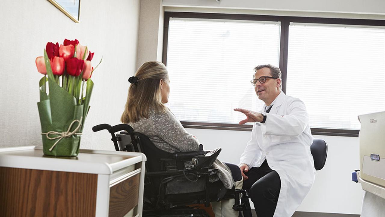 CBI Member Jan Schwab speaks with a spinal cord injury survivor